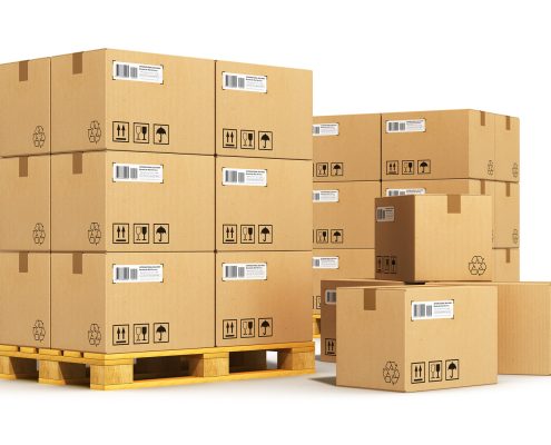 Creative cargo delivery and transportation logistics storage warehouse industry business concept: group of stacked corrugated cardboard boxes on wooden shipping pallets isolated on white background